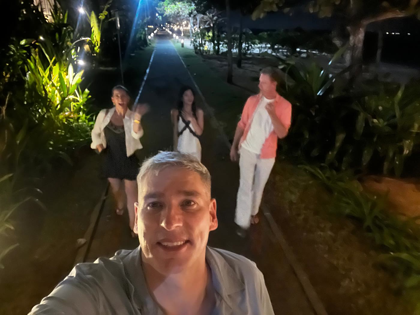 Night path in Bali — Barbie and John with friends